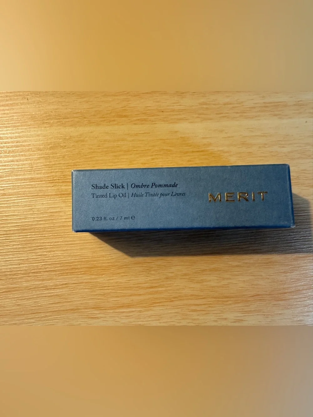 Merit Shade Slick Tinted Lip Oil in Cara Cara